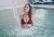 SPA Perugia ad Assisi Donna con bikini nero in piscina con cascata di acqua
