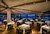 Ristoranti fuori Assisi con vista su Assisi a Santa Maria degli Angeli Ristorante elegante con tavoli apparecchiati e vista panoramica serale.